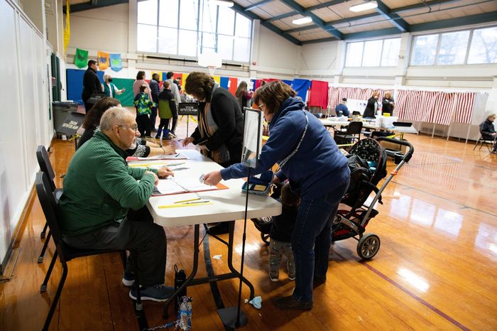 New Hampshire residents after voting during the presidential primary in January. PHOTO: KAYANA SZYMCZAK FOR THE WALL STREET JOURNAL