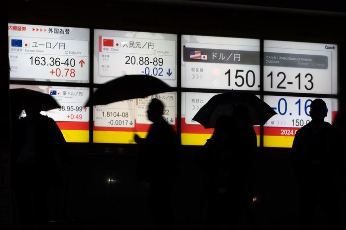 Many Japanese companies have improved their stock market performance by unloading weak units. PHOTO: TOMOHIRO OHSUMI/GETTY IMAGES